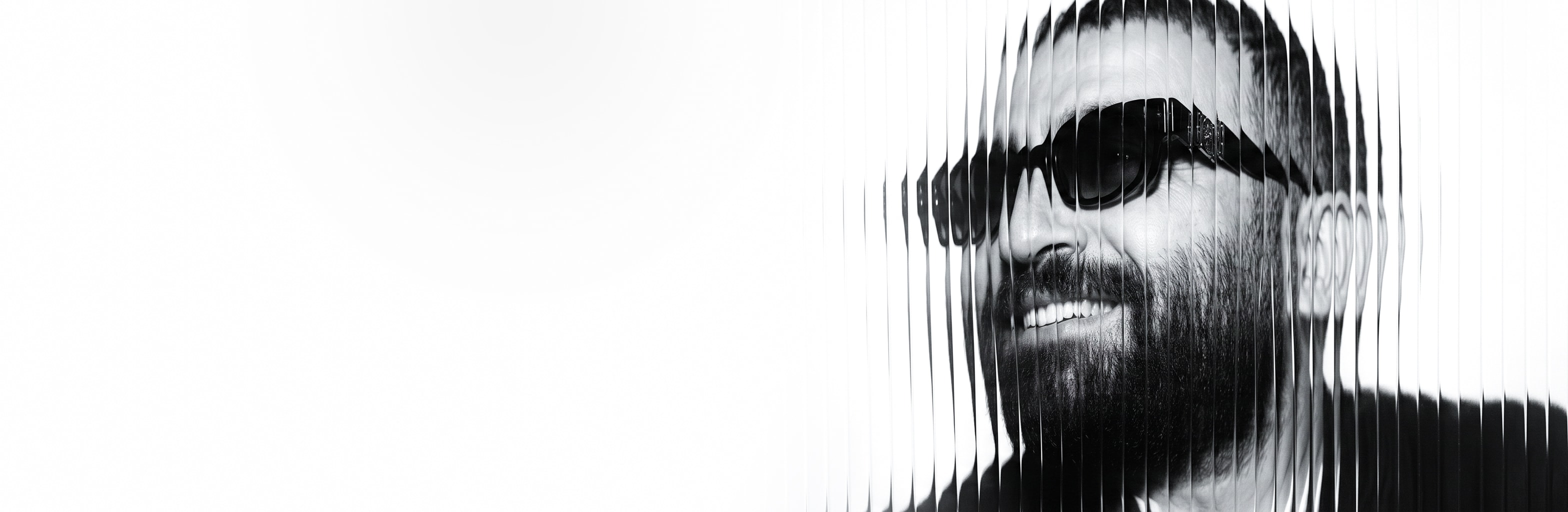 Rafat Mhalla, photographed behind fluted glass